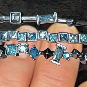 NWOT Kendra Scott gunmetal and blue bangle bracelets. Dust bag included.